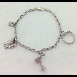 14 K White Gold charm bracelet with charms 1 carat